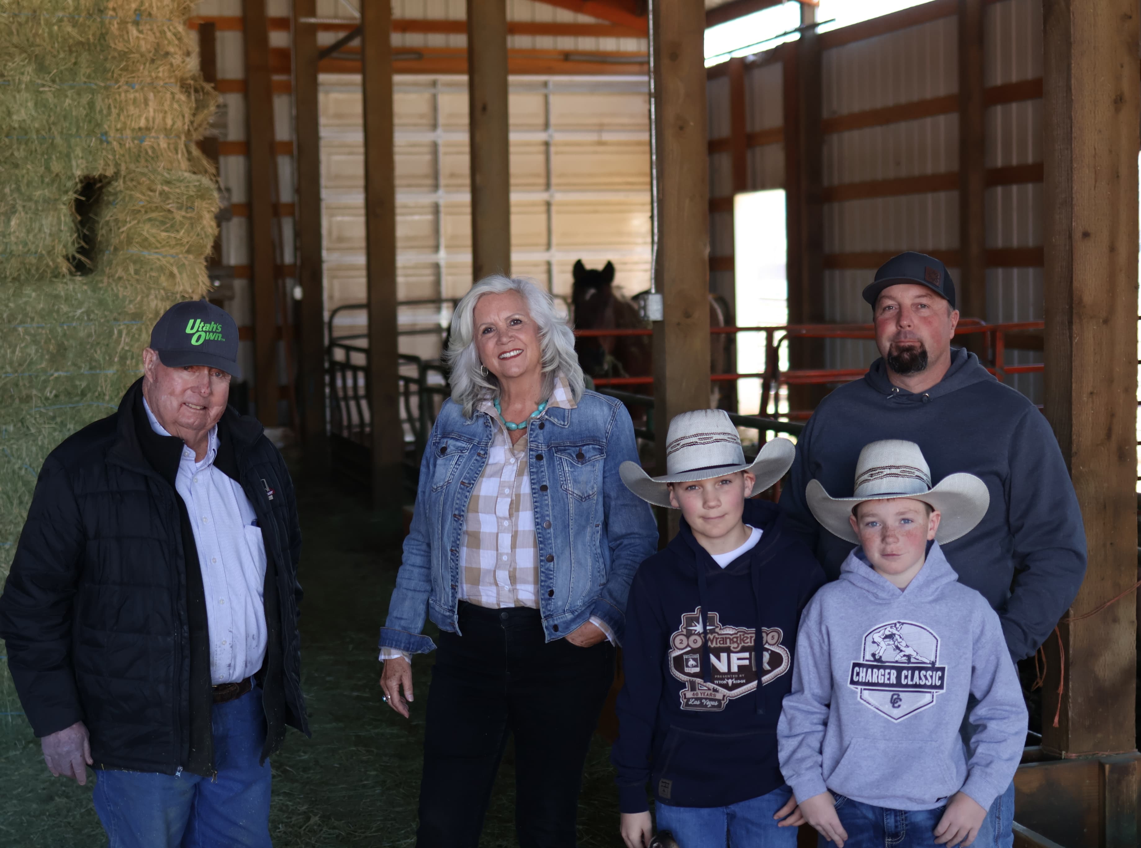 Celeste Johnson with family in a Wasatch Back barn